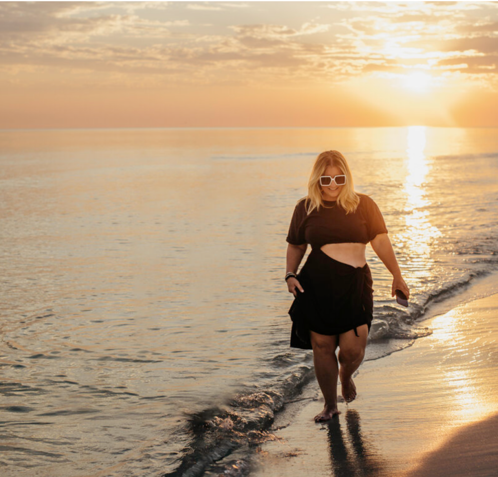 Kathy walking down the beach