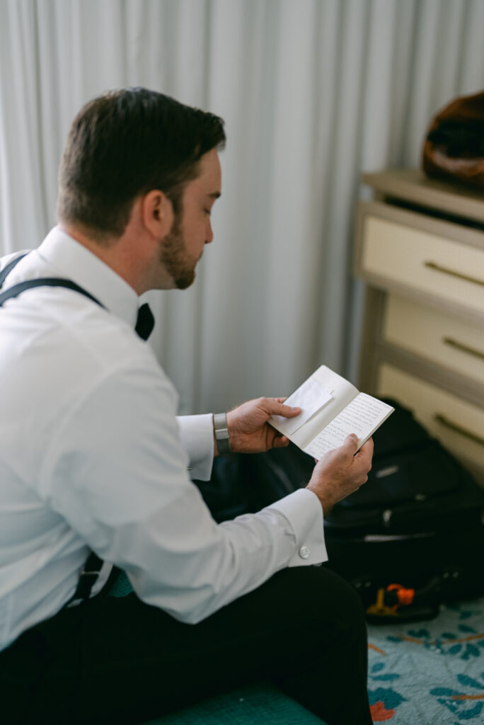 Groom reading love note on Socialite Events