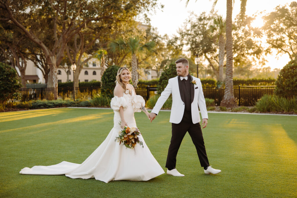 bride and groom on lawn at Caribe Royale Orland on Socialite Events Blog