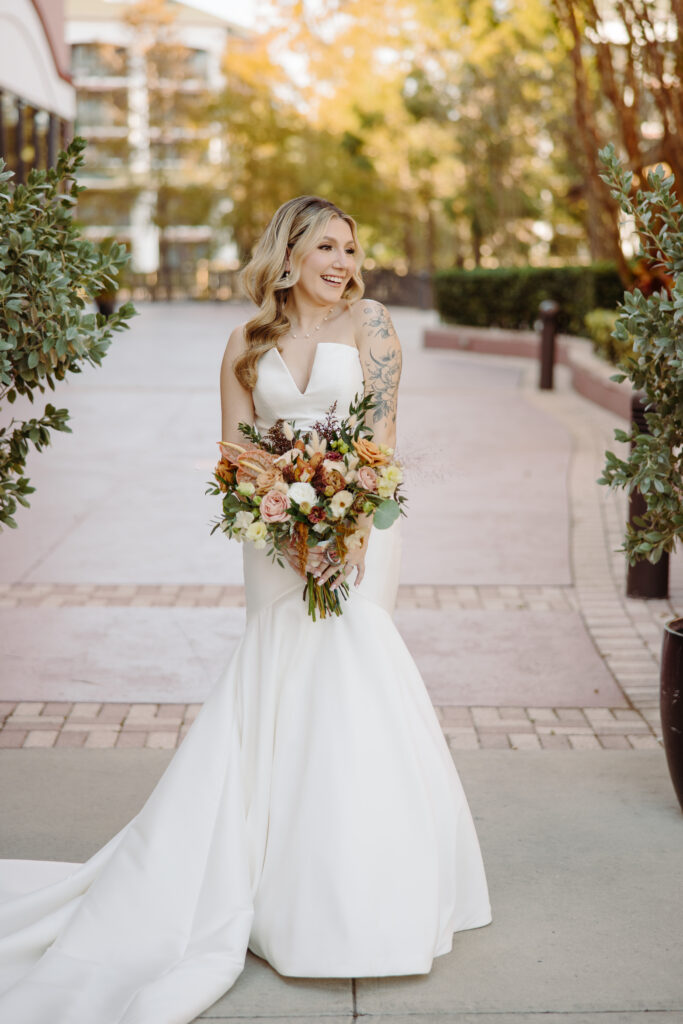 bride carrying large floral bouquet on Socialite Events Orlando