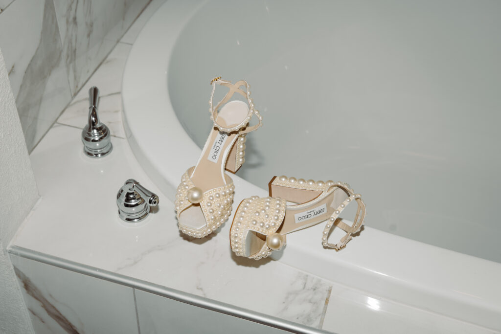 brides shoes on edge of tub at Caribe Royale Orlando