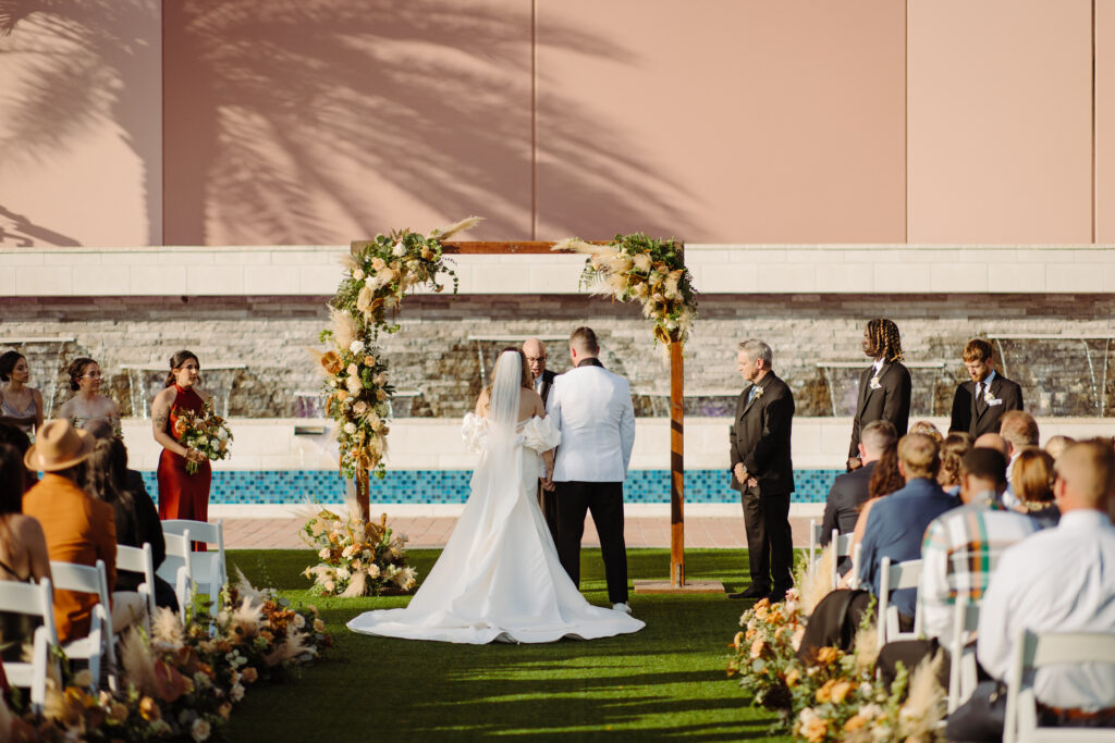 bride and groom at altar at a destination wedding Orlando on Socialite Events Blog