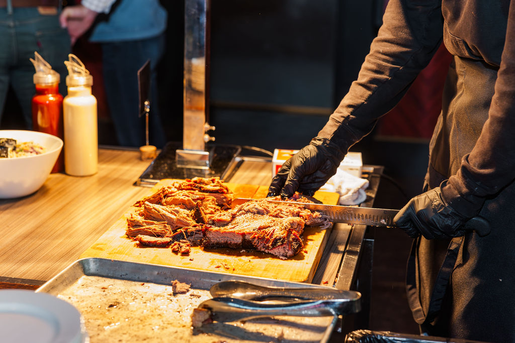 Hand sliced brisket being served at an event coordinated by Socialite, Orlando Event Planner