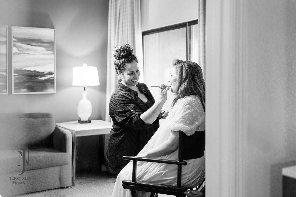 bride getting wedding hair and makeup done