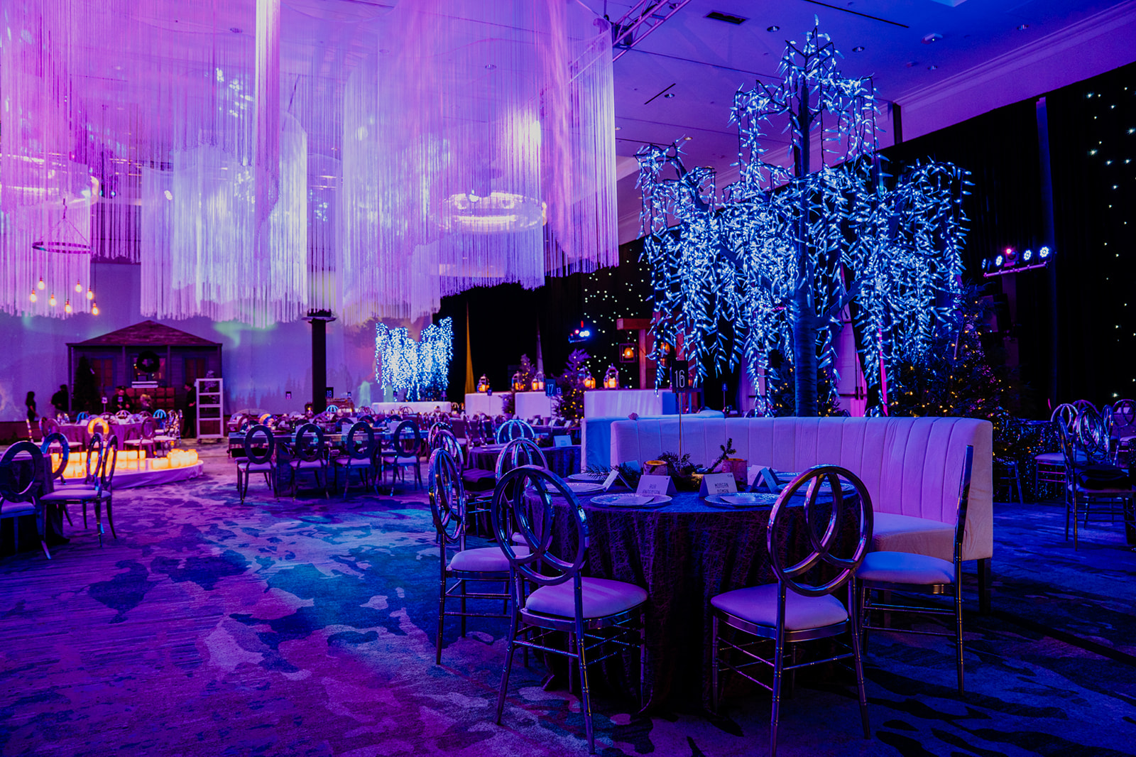 Moody purple and galaxy themed corporate holiday party